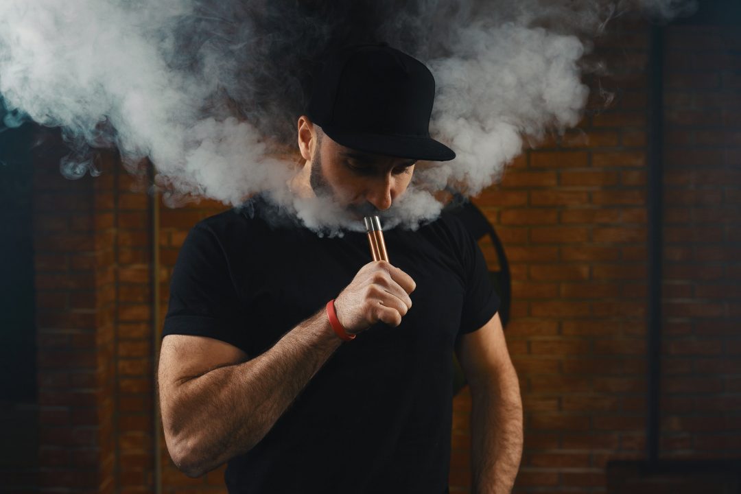Man vaping an electronic cigarette